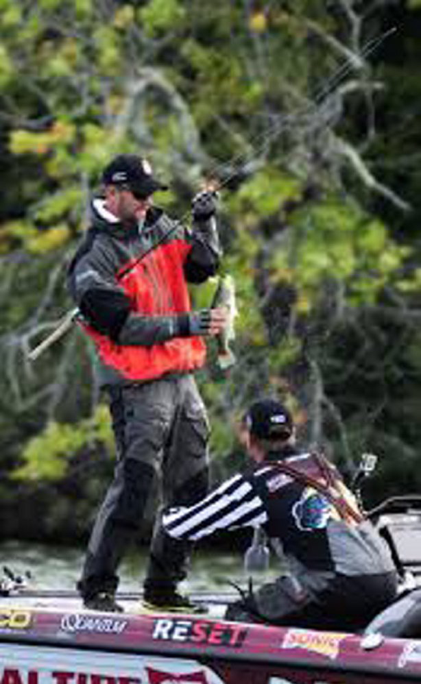 Professional fisherman Aaron Martens casts on China Lake during taping of a Major League Fishing event last summer. The championship round of the tournament filmed in the Belgrade-China area will be aired Sunday on CBS.