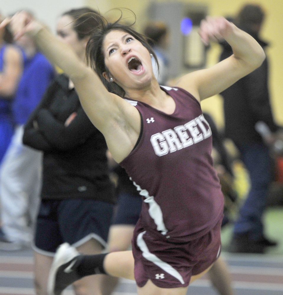 Alyssa Coyne of Greely lets out a yell as she throws the shot put during the Western Maine Conference indoor track and field championships in Gorham Friday. Coyne won with a throw of 39-1 and also was victorious in the pole vault.