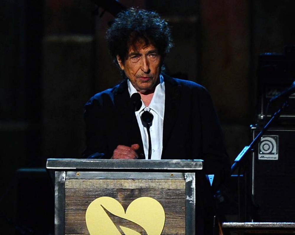 Bob Dylan accepts the 2015 MusiCares Person of the Year award on stage at the 2015 MusiCares Person of the Year show at the Los Angeles Convention Center on Friday.