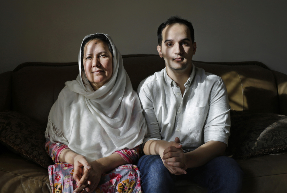 Shamim Syed, left, whose son Adnan was convicted in the 1999 murder of his ex-girlfriend, is shown alongside son Yusef at her Baltimore home. Adnan, the subject of popular podcast “Serial,” will be allowed to appeal his murder conviction, a Maryland court has ruled.