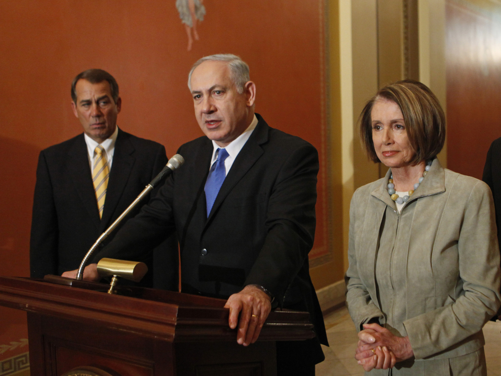 In this March 23, 2010 file photo, Israeli Prime Minister Benjamin Netanyahu, center, flanked by then-House Minority Leader John Boehner of Ohio and then-House Speaker Nancy Pelosi of Calif., speaks to the media on Capitol Hill in Washington.