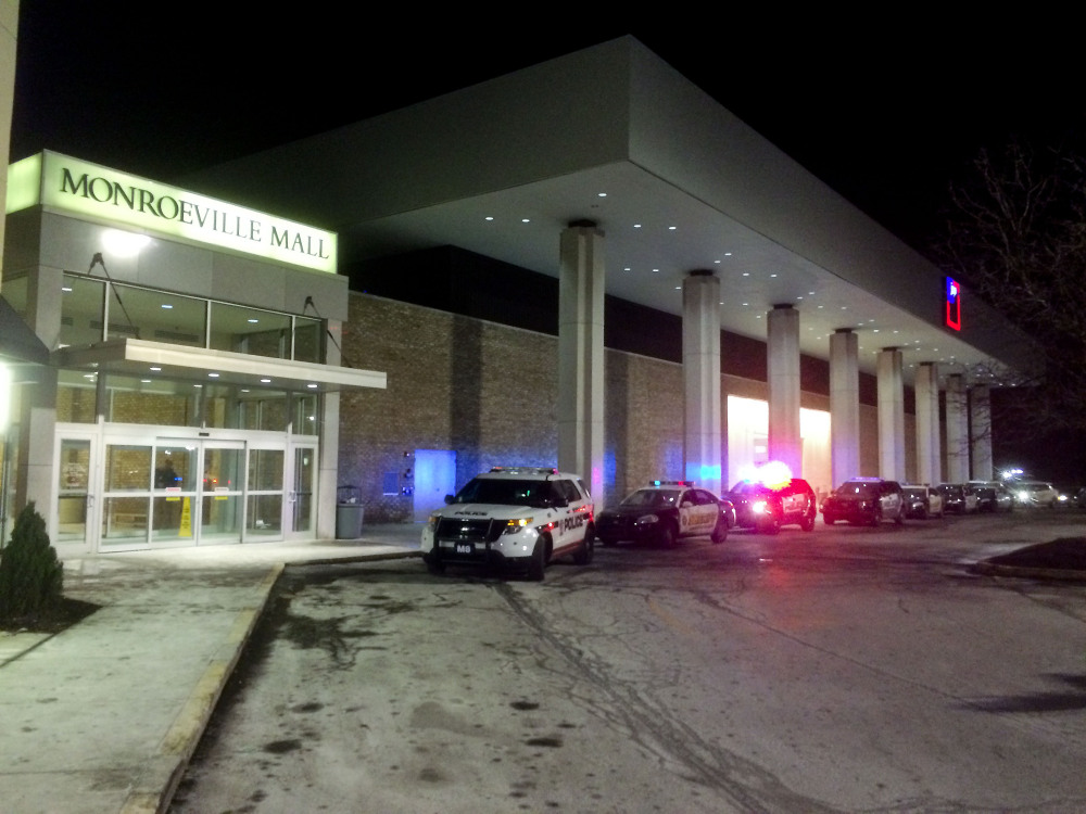 Police vehicles line up outside Monroeville Mall on Saturday after a shooting took place inside. As many as three people were injured.