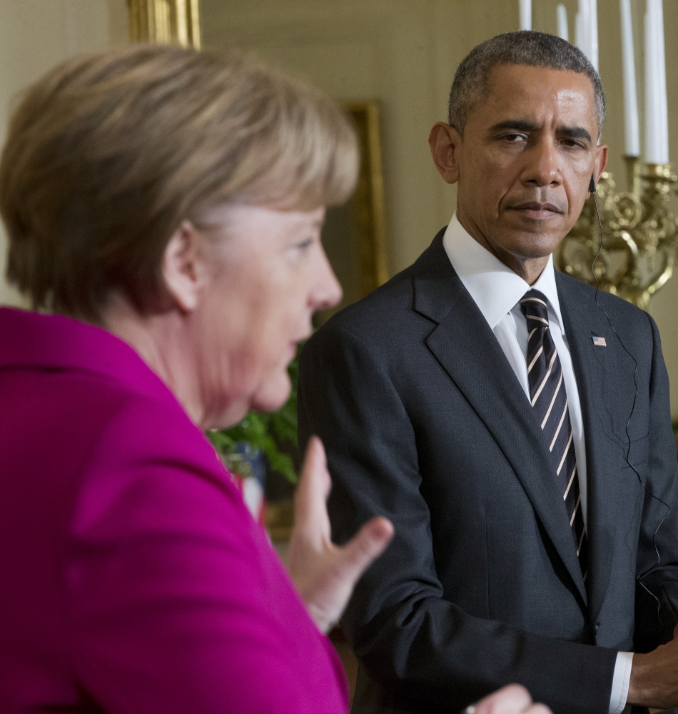 President Barack Obama says he’s open to giving the Ukrainian government military support while German Chancellor Angela Merkel, left, said Monday she opposes the idea.