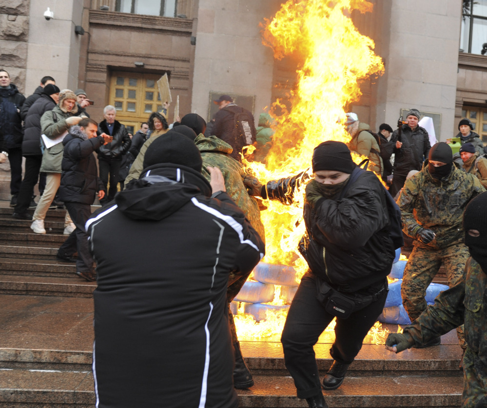 Heavy fighting in a separatist stronghold isn’t the only problem facing Ukrainian leaders as protesters burn tires outside Kiev’s city council building due to a fee hike.
