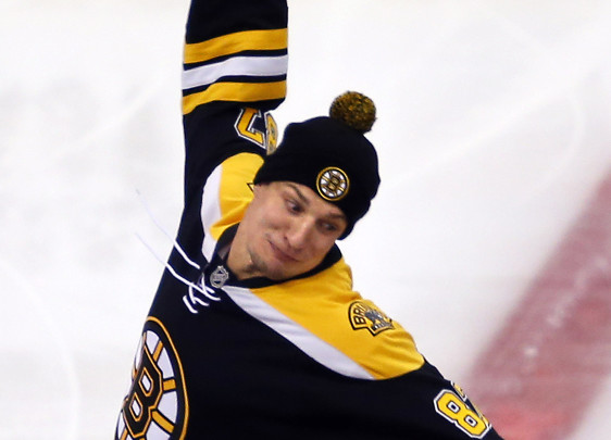 Rob Gronkowski changed his Patriots uniform to a Bruins jersey and then spiked a puck before the Islanders game on Saturday.