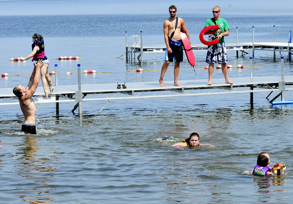 Campers cool off in North Pond at Pine Tree Camp in Rome in July. The camp, which serves people with disabilities, is among those that would be affected by Gov. Paul LePage’s proposal to tax nonprofit institutions.