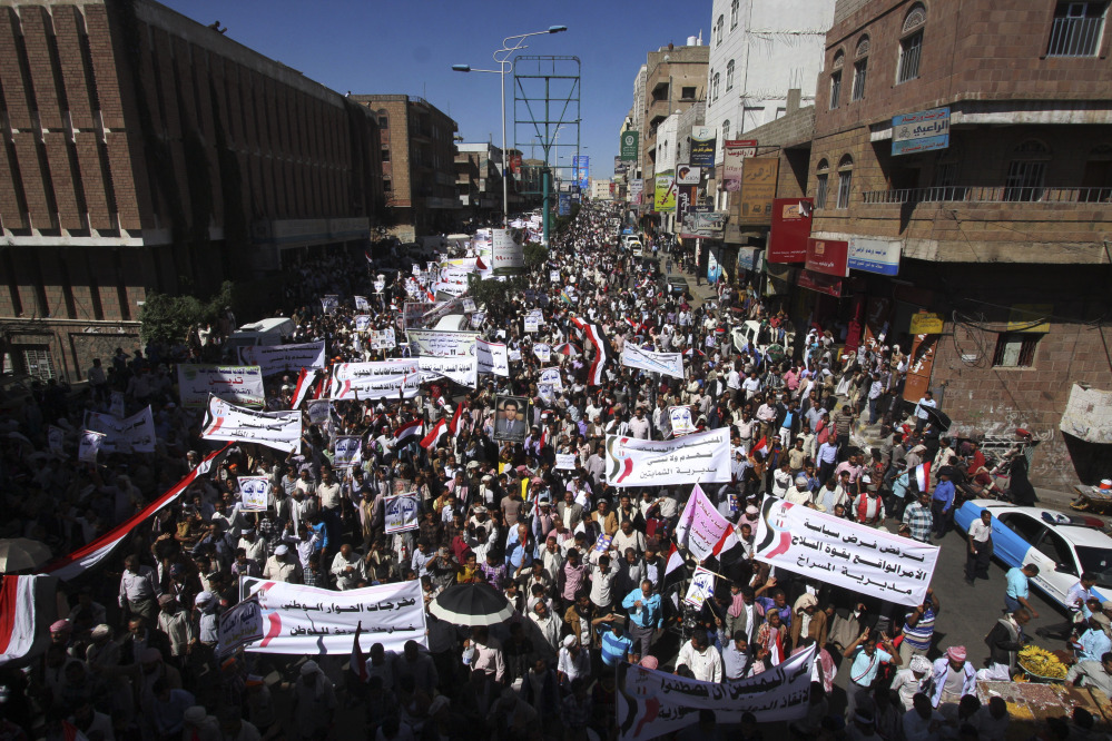 Yemeni demonstrators protest against Houthi Shiites who have seized power in the capital, Sanaa, while they celebrate the fourth anniversary of the uprising in Taiz, Yemen, on Wednesday.