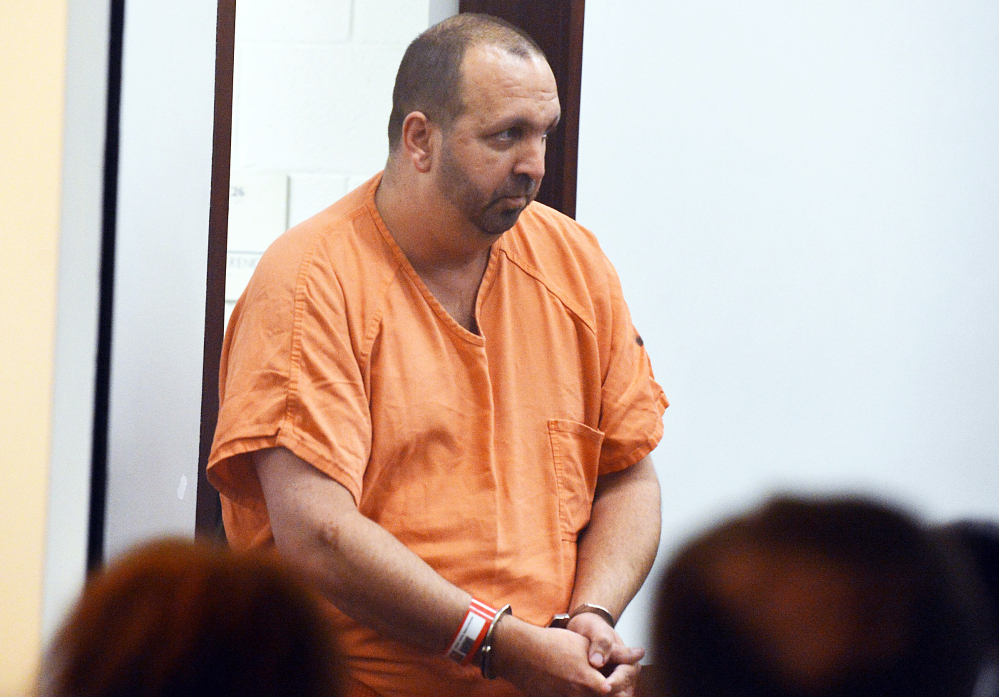 Craig Stephen Hicks, 46, enters the courtroom for his first appearance at the Durham County Detention Center on Wednesday in Durham, N.C. Hicks, 46, is accused of shooting Deah Shaddy Barakat, 23, Yusor Mohammad, 21, and Razan Mohammad Abu-Salha, 19, at a quiet condominium complex near the University of North Carolina campus.