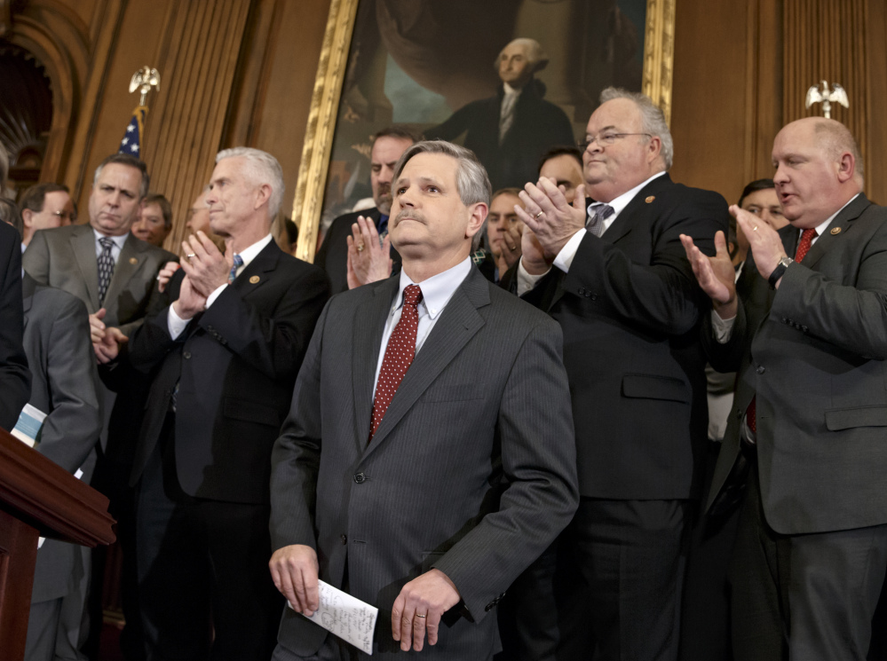 Sen. John Hoeven, R-N.D., sponsor of the Senate version of the Keystone XL pipeline bill, is applauded Wednesday as he and other lawmakers urge President Obama to sign the legislation passed in the House and Senate approving the project.