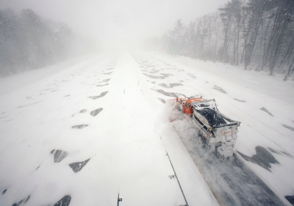 A plow clears a northbound lane of the Maine Turnpike in Kennebunk during the Jan. 27 blizzard. “We plan for winters like this,” said Peter Mills, the Maine Turnpike Authority’s executive director.