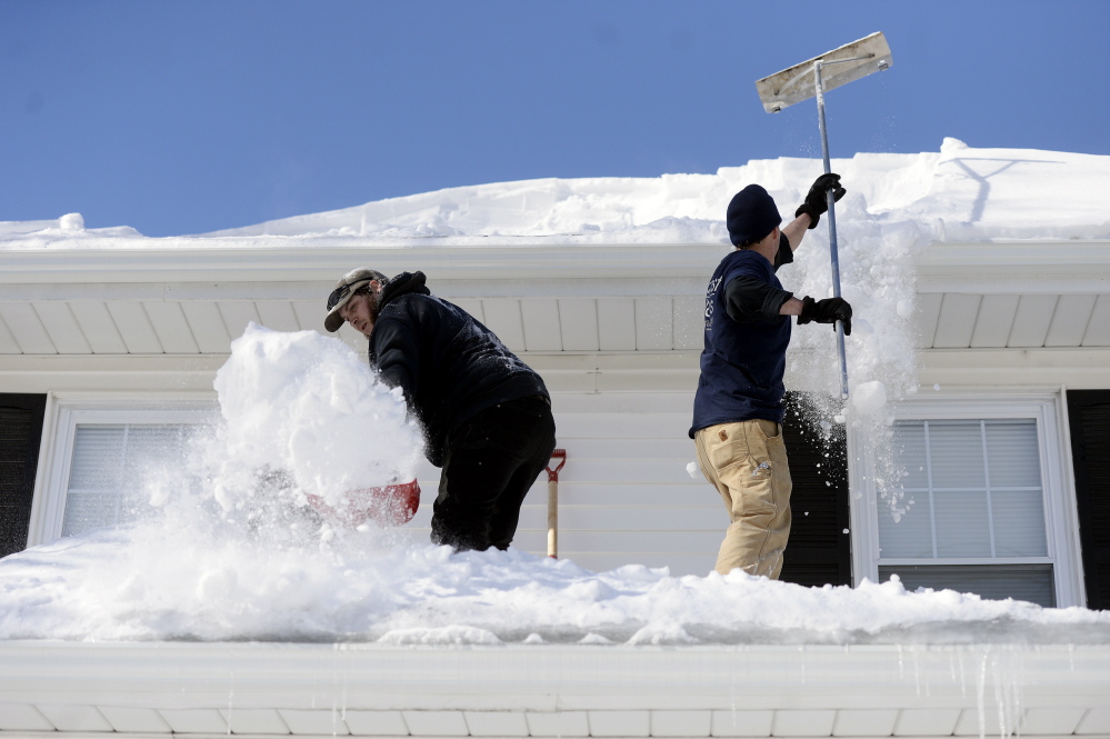 A more significant danger than snow buildup, engineers say, are clogged gutters and ice dams on roofs. As more melting snow is blocked by the ice dams, water can seep under the shingles and leak inside a house.