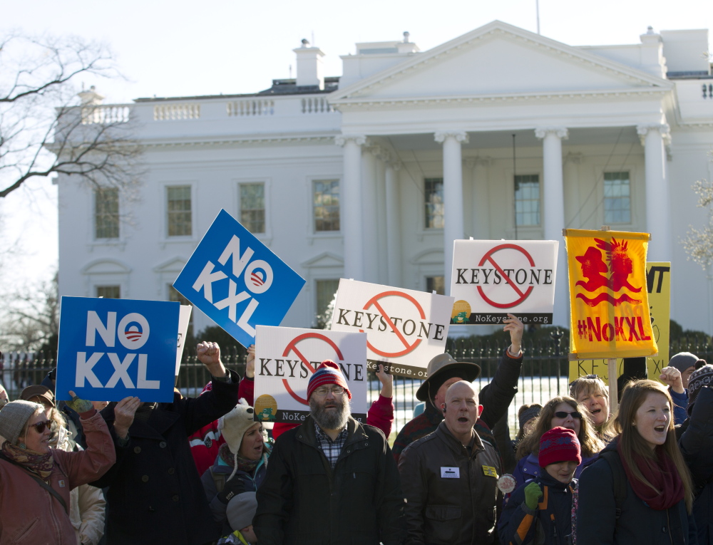 Dozens of demonstrators rally in January outside the White House in support of Obama’s pledge to veto any legislation approving the Keystone XL pipeline. Congress Wednesday gave approval that would expedite the pipeline.