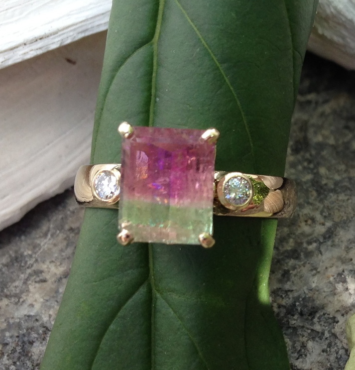 The upside of a ring with a watermelon tourmaline center stone is it speaks of Maine. The downside is the stone is not as durable as harder ones, such as diamonds.