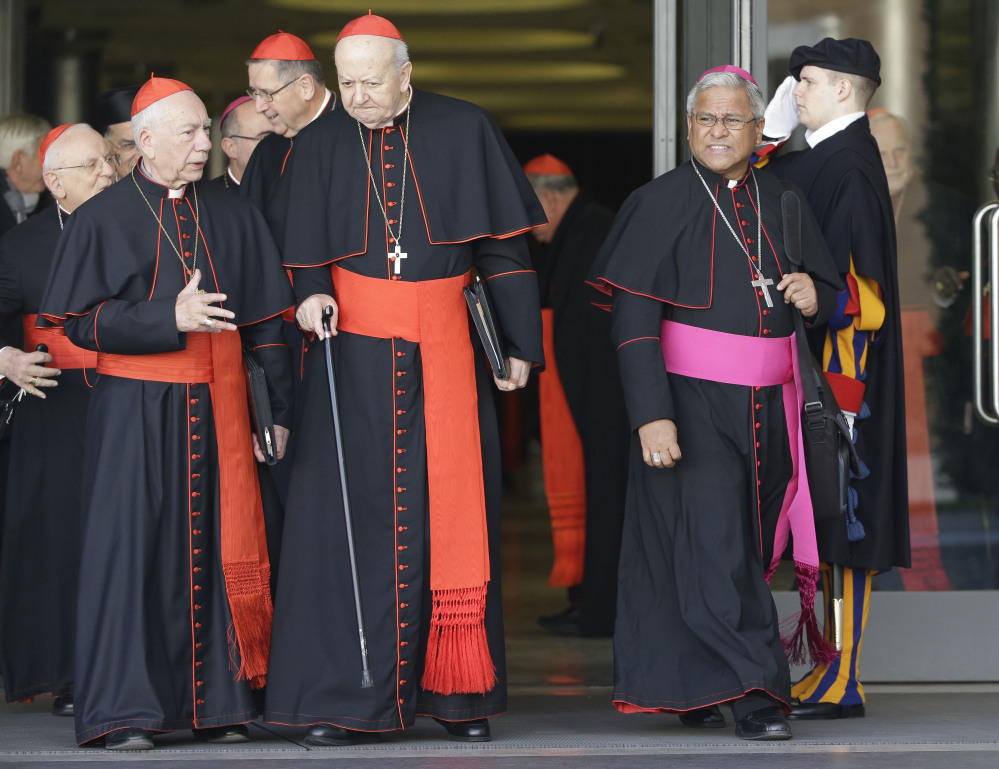 Soane Patita Paini Mafi, Archbishop of Tonga, right, leaves after a special consistory at the Vatican on Thursday. Pope Francis met with cardinals and bishops who will take part in Saturday’s consistory during which he will elevate 20 new cardinals.