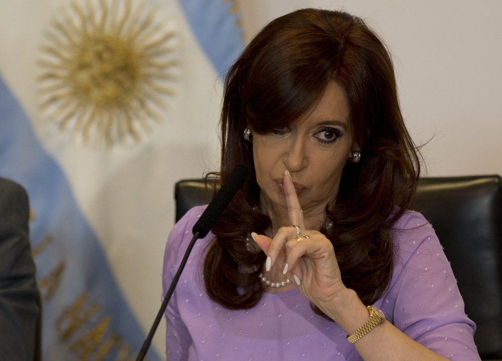 Argentina’s President Cristina Fernandez signals to supporters during an event announcing new government projects in Buenos Aires, Argentina, on Wednesday.