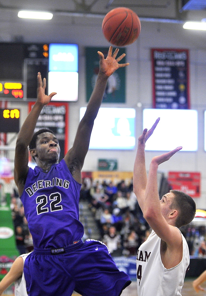 Free throws and a pivotal block made a huge difference Friday night as Ben Williams came up big for Deering. Williams puts up a jumper during the 61-59 victory against Gorham at the Expo.