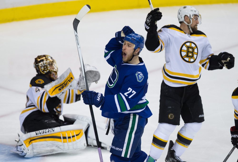 The Vancouver Canucks’ Shawn Matthias (27) celebrates his third goal against Bruins goalie Tuukka Rask during the third period of Friday night’s game in Vancouver, British Columbia.