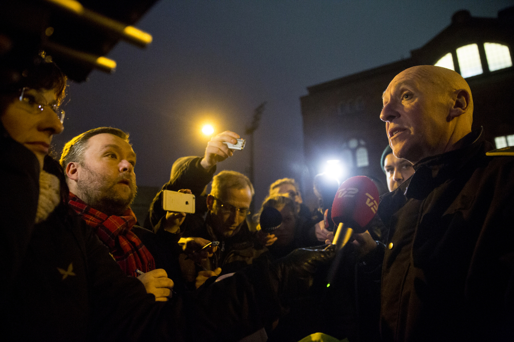 Senior police inspector Jorgen Skov, right, speaks during a news conference, after shots were fired at a cafe in Copenhagen, Denmark, on Saturday in a likely terrorist attack.
