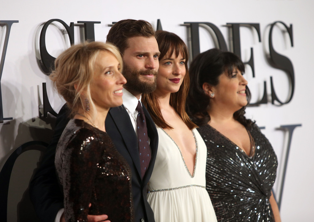 Sam Taylor-Johnson, Jamie Dornan, Dakota Johnson and E.L. James arrive at the UK premiere of “Fifty Shades of Grey” Thursday.