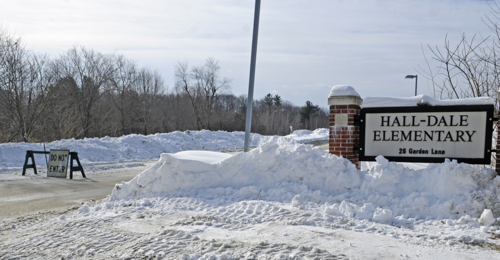 A barricade blocks Garden Lane in Hallowell, the driveway to Hall-Dale Elementary School, after an early-morning natural gas leak on Feb. 7. The leak was caused by a contractor’s loader striking a gas pipe attached to the school while removing snow.