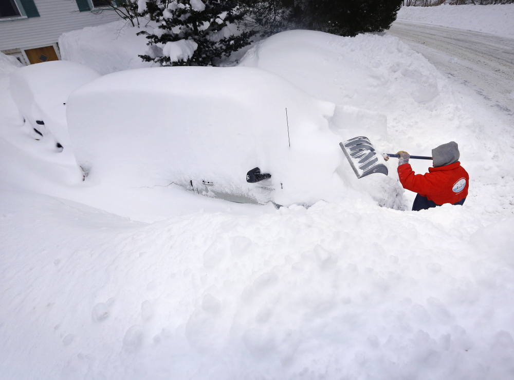 Rich Grafe of Kittery Point digs out his vehicles after a storm that left over a foot and a half of fresh snow in Kittery.