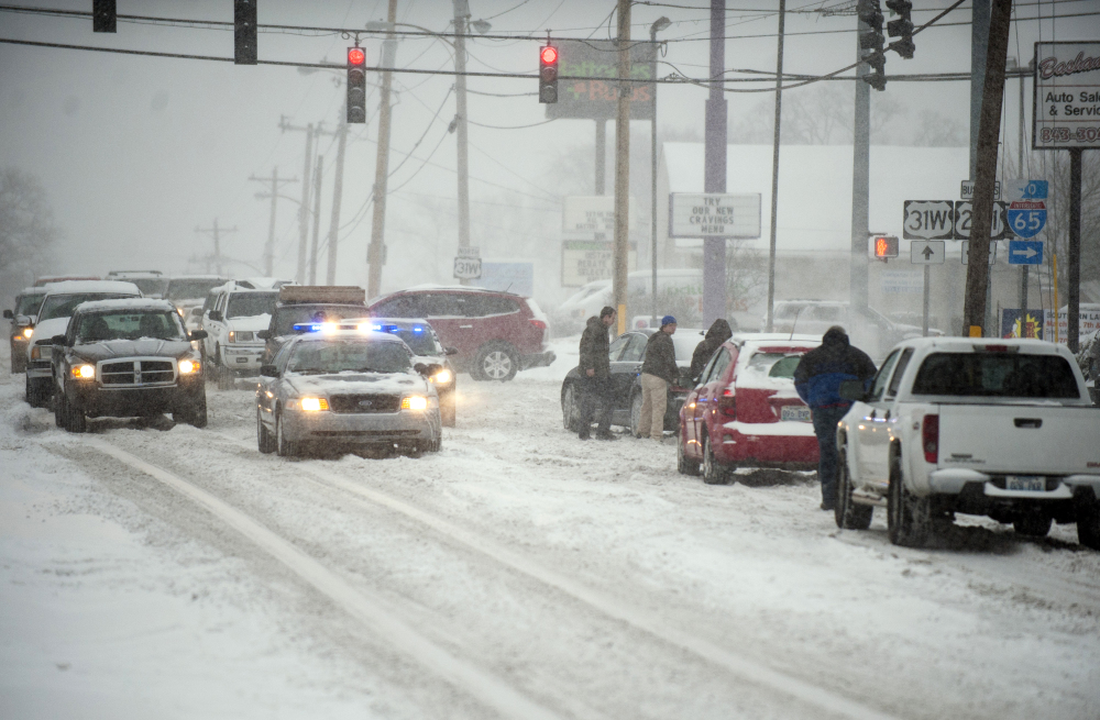 Law enforcement help stuck motorists Monday after several inches of snow fell in Bowling Green, Kentucky. The National Weather Service said anywhere from 6 to 15 inches of snow are possible by evening.