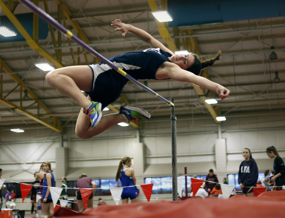 FEB. 16
CLASS B GIRLS INDOOR TRACK
Emma Egan of Yarmouth sets a state record in the high jump with this leap of 5 feet, 4  inches during the Class B indoor track and field championships at Bates College in Lewiston.
