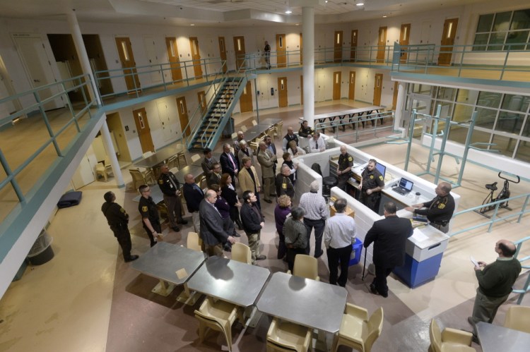 Legislators and county officials take a tour of a pod in the Cumberland County Jail in Portland in late January.