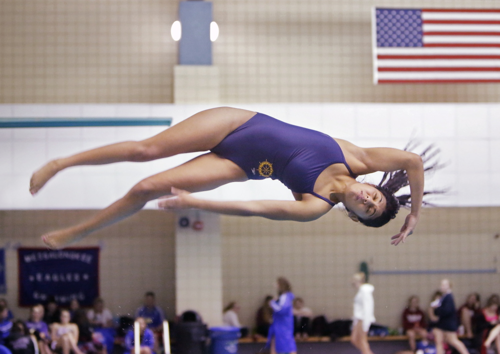 Three years, three state diving championships for junior Charlotte Janelle of Falmouth, who fell short of her personal goal of 415 points, which would have been a pool record at Bowdoin College, but her score of 395.25 was far in front of anyone else.