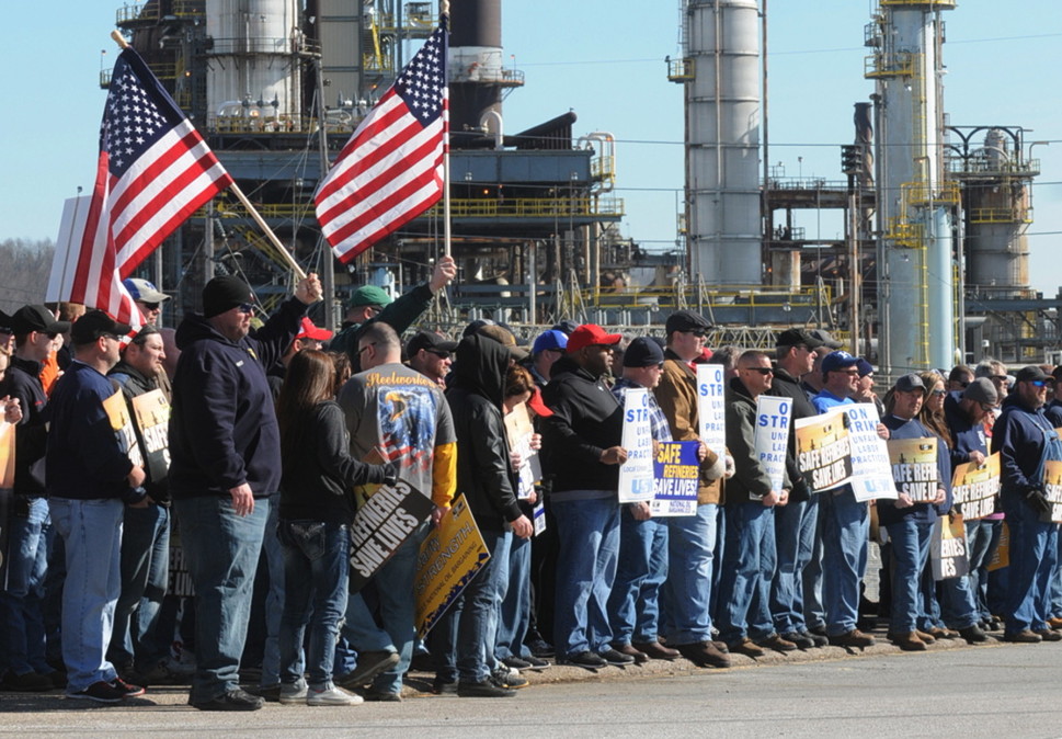 Members of the United Steelworkers union hold a rally at the entrance to the Marathon refinery in Catlettsburg, Ky., on Feb. 7. A USW walkout at 11 refineries is in its third week.