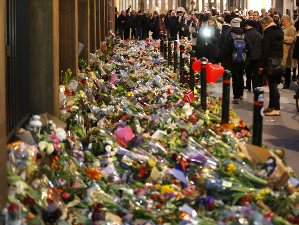 Flowers are laid in front of the synagogue in Copenhagen, Denmark, on Tuesday.