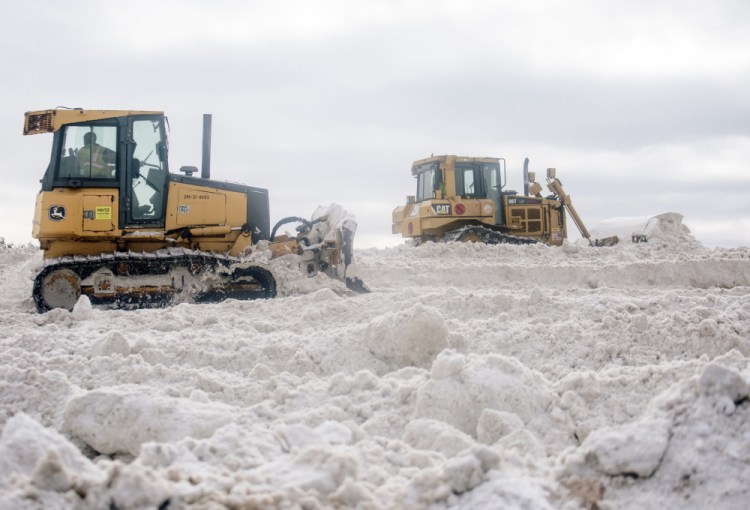 Portland workers keep the pile of dumped snow near the jetport at 40 feet or below so they can operate large machinery on it without exceeding the FAA height limit.