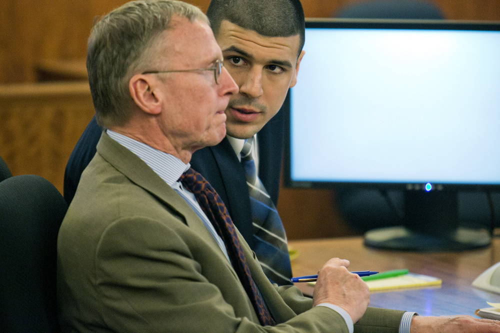 Aaron Hernandez, right, consults with defense attorney Charles Rankin during his murder trial at the Bristol County Superior Court in Fall River, Mass., on Wednesday. Hernandez is accused in the June 17, 2013, killing of Odin Lloyd.