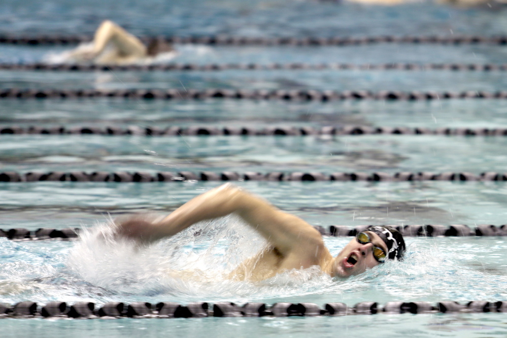 Jake Perron of Falmouth draws in some air while distancing himself from the competition in the 500-yard freestyle. Perron won both the 200 and 500 freestyle and was named performer of the meet.