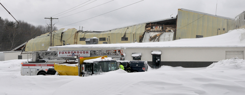 A warehouse-style building at Foxborough Terminals in Foxborough, Mass., collapses from the weight of snow on the roof, which gave way on Sunday.