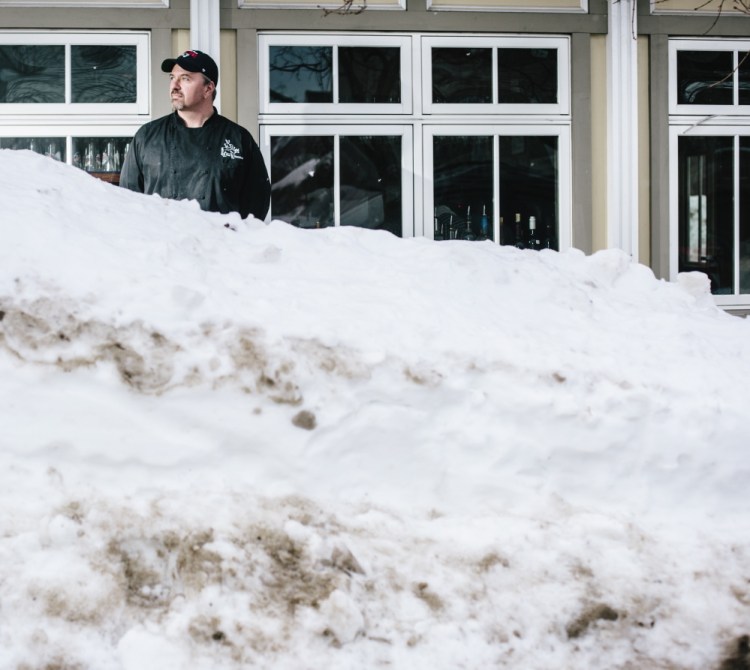This winter’s frequent storms have been tough on dining establishments such as The Front Room at 73 Congress St. in Portland, one of four restaurants owned by Harding Smith, outside The Front Room above. Snowbanks and parking bans have kept customers away, Smith said.
