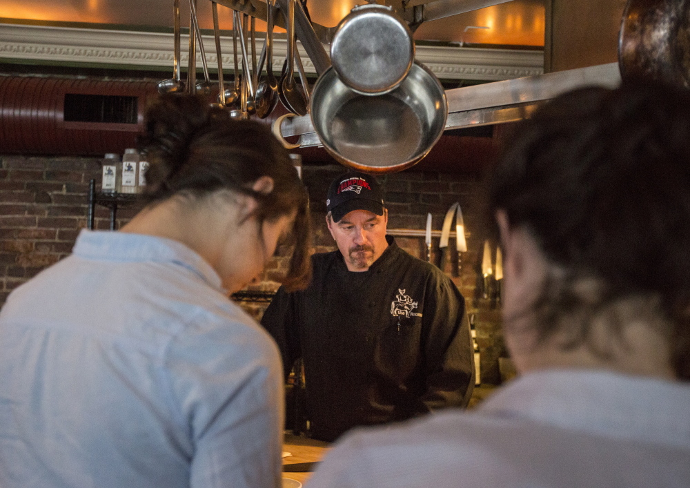 The Front Room chef and owner Harding Smith speaks to his staff before dinner service Wednesday. On Valentine’s Day, Smith said business was down at least 40 percent because forecasts calling for a blizzard alarmed customers. Only 2.3 inches fell in Portland.
