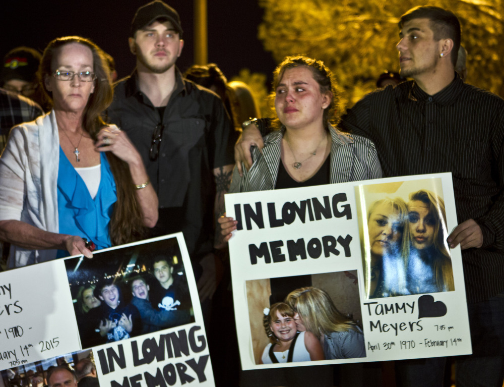 Participants in Tuesday’s candlelight vigil for Tammy Meyers mourn the woman taken off life support on Saturday after a Las Vegas shooting. Police say the killing has morphed into a more complex scenario, prompting a backlash against Meyers’ family.