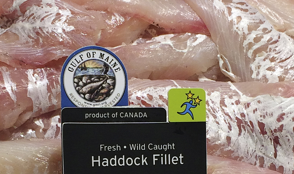 Haddock fillets on display at the Portland Hannaford bear the Gulf of Maine Research Institute label certifying that the product was harvested sustainably between Cape Cod and Nova Scotia. The institute wants New England colleges and universities to serve seafood carrying its label.