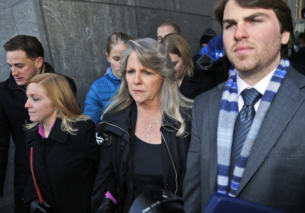 Former Virginia first lady Maureen McDonnell, center, leaves federal court with her son Bobby, right, and daughter Cailin Young, left, after being sentenced to one year and one day on corruption charges in Richmond, Va., on Friday.