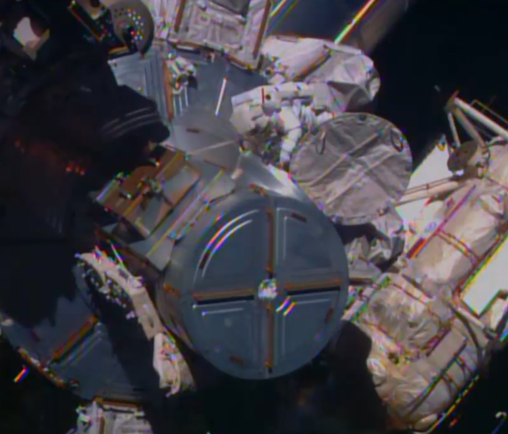 In this image from television, astronaut ButchWilmore begins the spacewalk Saturday morning to wire the International Space Station in preparation for the arrival in July of the international docking port for the Boeing and Space-X commercial crew vehicles.