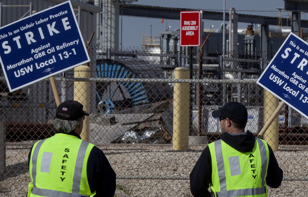 Workers picket at Marathon Petroleum’s Galveston Bay refinery in Texas City this month.