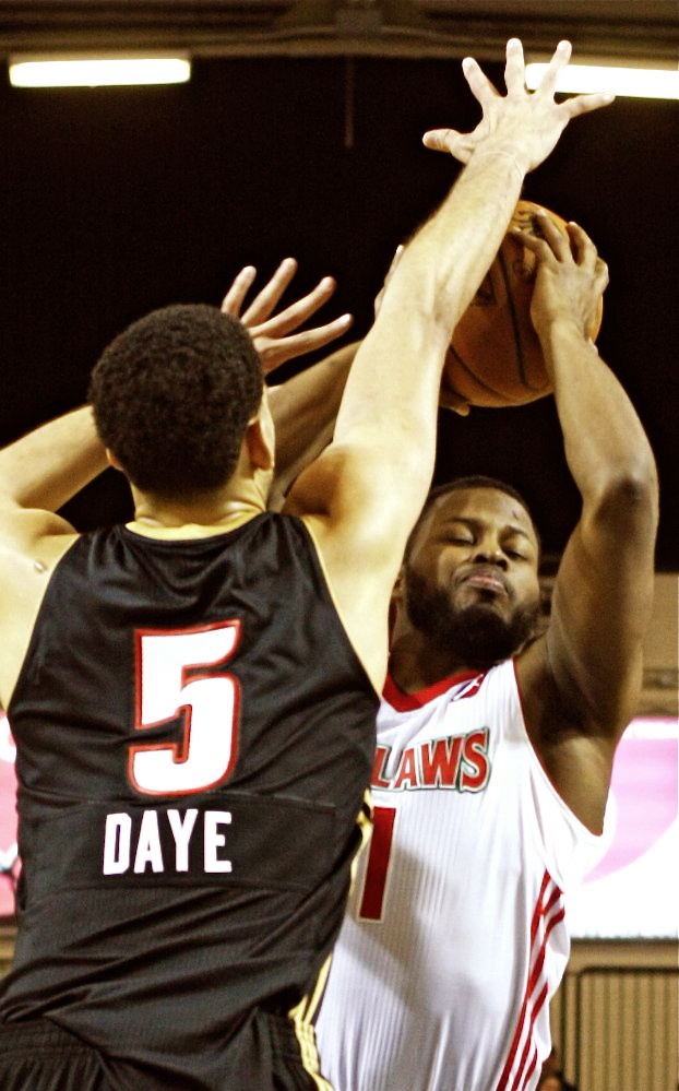 Red Claws' Andre Stringer goes up for a shot while being defended by Erie’s Austin Daye during the Red Claws' 120-92 win Sunday at the Portland Expo. Stringer scored 19 points.
