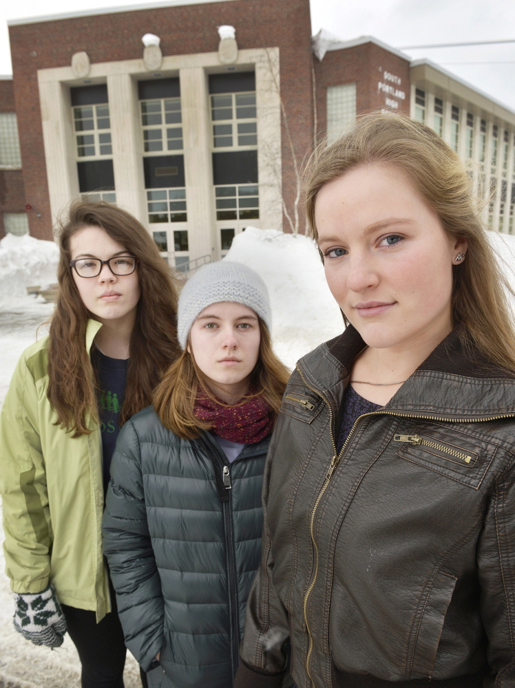 South Portland senior class president Lily SanGiovanni, right, and supporters Morrigan Turner, left, and Gaby Ferrell say some students have felt uncomfortable or pressured by teachers to recite the Pledge of Allegiance at school, so SanGiovanni let students know they could choose not to say it.