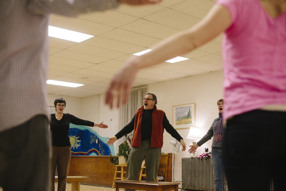 Director Al D’Andrea of Snowlion Repertory Company leads actors in a voice warmup exercise before a rehearsal last week. The 17 actors in “The Maine Dish” production play several roles in a dozen short plays.