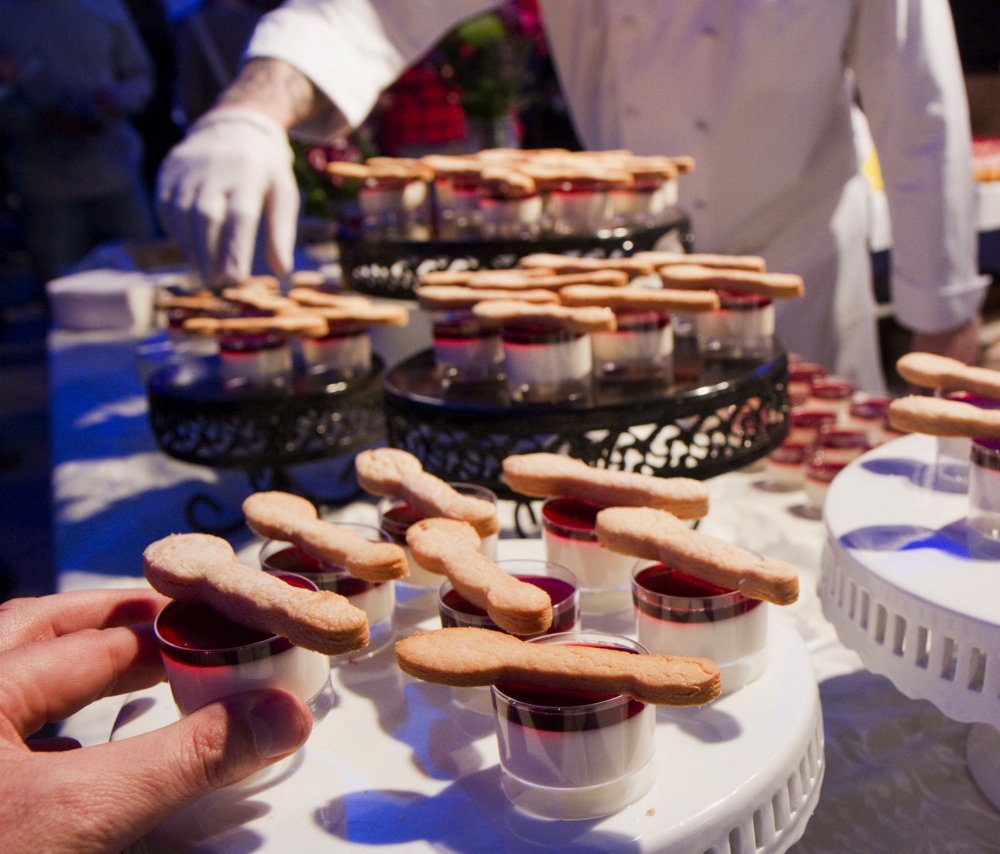 Servers set out a dessert called “Pannabutta & Jelly” by Walter’s restaurant of Portland during the 2013 “Signature Event.”