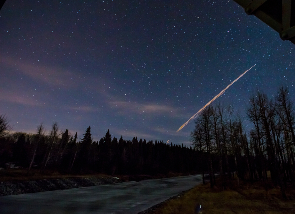 Canadian photographer Neil Zeller’s 10-second time exposure photo shows a streak of light from a Chinese rocket burning up upon re-entry in the atmosphere.