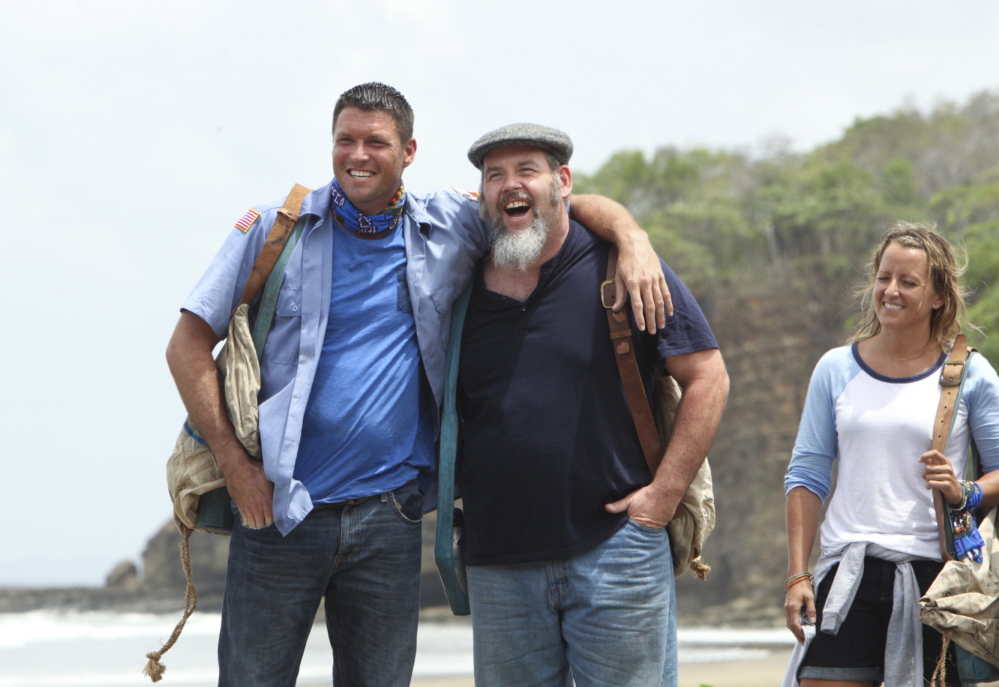 Mike Holloway, Dan Foley, center, and Kelly Remington of the Blue Collar Tribe share a light moment as the new season of “Survivor” got underway Wednesday on CBS. At one point in the premiere, Foley, a Gorham postal worker, told the camera “I am here to live my dream.”