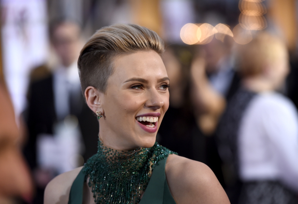 Scarlett Johansson said John Travolta’s gestures at the Oscars were “very sweet and totally welcome.”