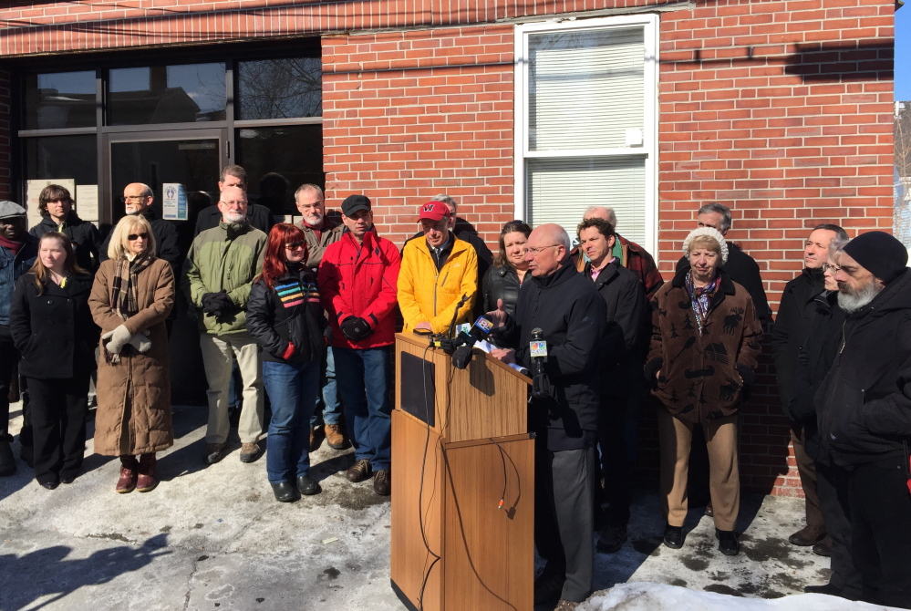 Portland Mayor Michael Brennan speaks Friday outside the city’s Oxford Street Homeless Shelter during a news conference at which he defended the city’s General Assistance program following an audit by the Maine Department of Health and Human Services.